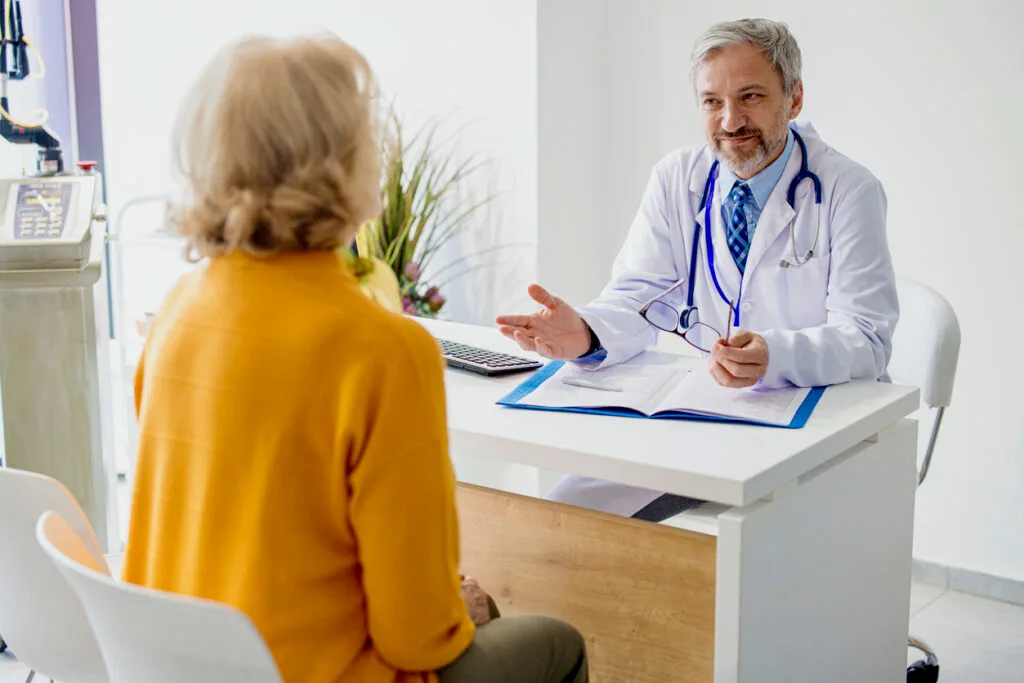 Doctor explaining hormone replacement therapy to his patient